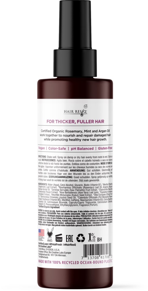 Eine dunkle Flasche mit Sprühkopf enthält Haarpflegeprodukt, gekennzeichnet für volleres Haar mit natürlichen Inhaltsstoffen.