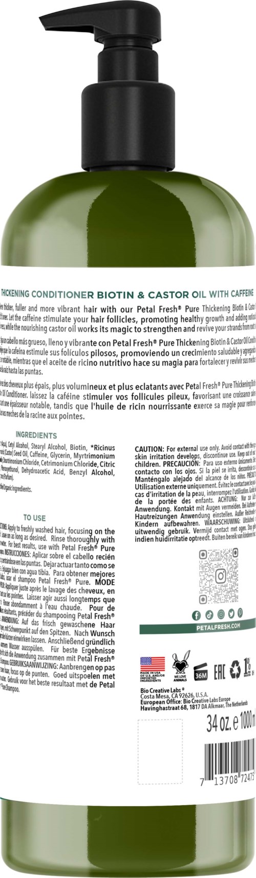 Grüne Flasche mit Pumpe, Etikett mit Text und kleinen Symbolen am unteren Ende.