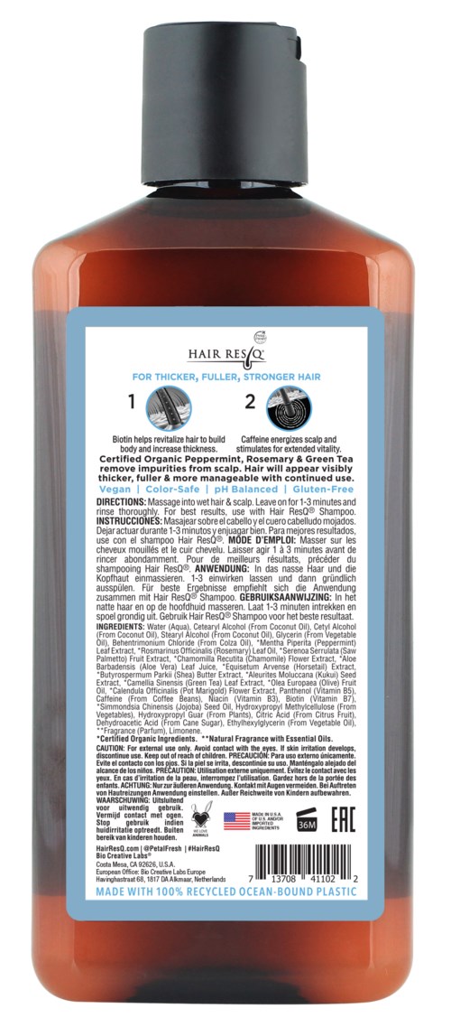 Dies ist eine Flasche Haarbehandlung oder Shampoo mit blauer Etikette und schwarzem Deckel.