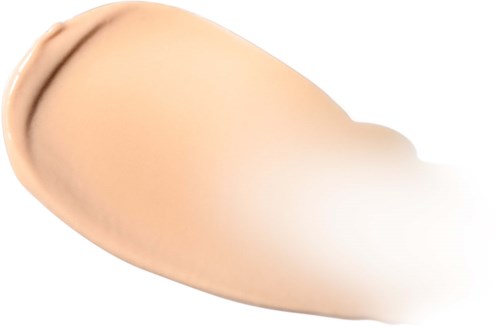 En beige flytende foundation som blends på huden med en børste.