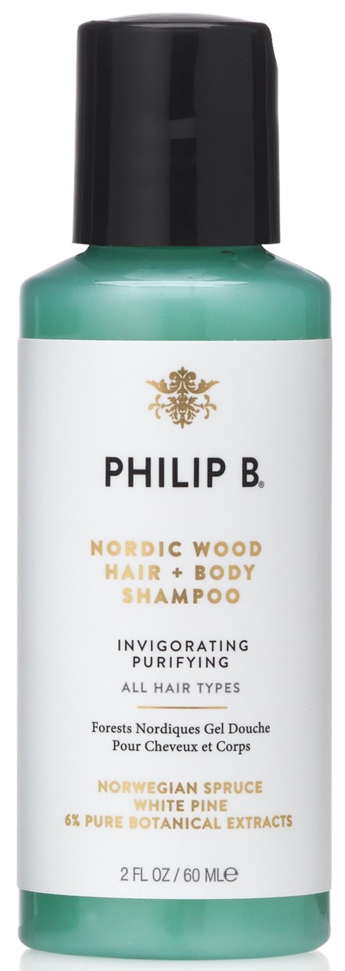 En grön och vit flaska av Philip B. Nordic Wood schampo med svart lock, främjar friskt hår, innehåller norsk gran och tall.