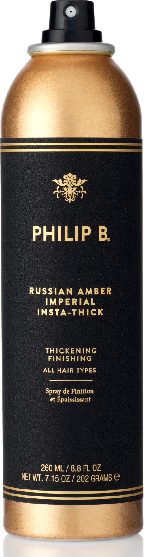 En svart och gul sprayflaska av Philip B. hårprodukt märkt 'Russian Amber Imperial' för att tjockna alla hårtyper.