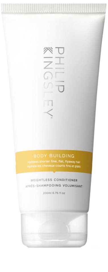 En hvit tube med gullfarget etikett, inneholder Philip Kingsley Body Building volumgivende balsam.