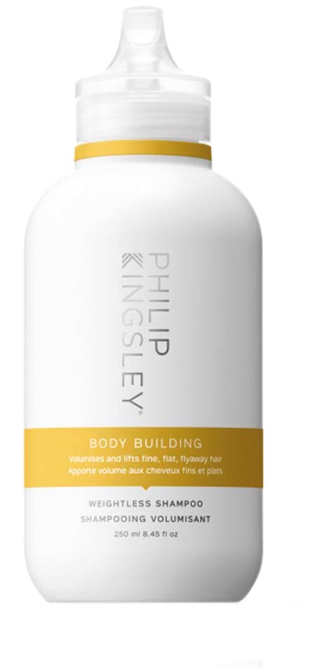 En hvit flaske med en gul stripe, merket 'Philips KingSley' og 'Body Building' sjampo, 250 ml.