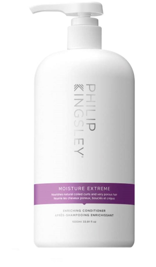 En hvit flaske med Philip Kingsley Moisture Extreme balsam med lilla etikett og pumpehode.