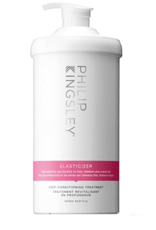 A white bottle with a pump labeled "Philip Kingsley" and pink stripe, for hair treatment.