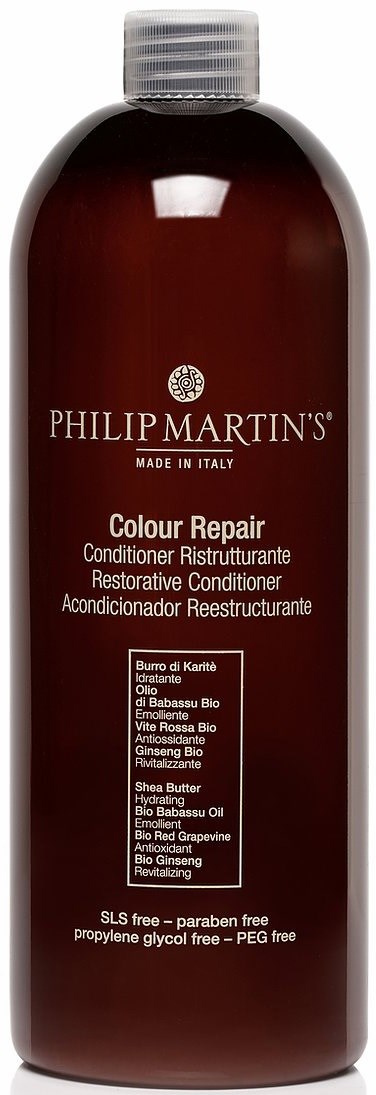 Ciemnoczerwona butelka z srebrnym korkiem, oznaczona jako Philip Martin's Colour Repair odżywka, zawiera naturalne składniki i jest bez parabenów.