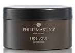 En rund svart beholder med lokk, merket 'Philip Martin's Face Scrub' i gull og hvit tekst.