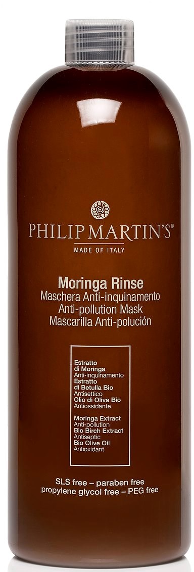 En brun flaske merket Philipp Martins Moringa Rinse, med en sølvhette og produktdetaljer i hvit tekst.