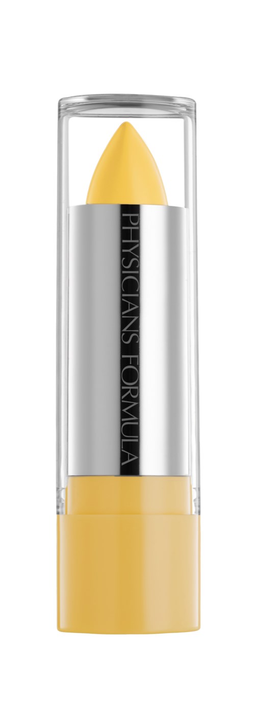 En gul concealer-stift i en klar plastboks med gullfarget kork.
