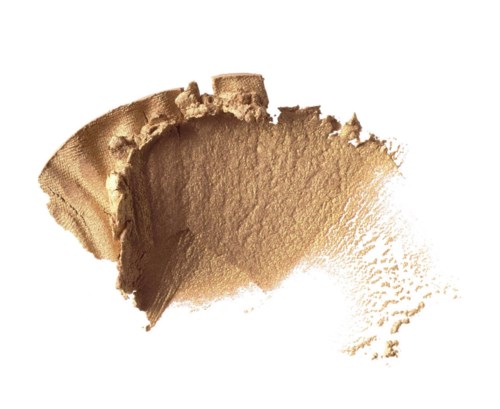 A beige powder spread with some texture and uneven edges, with a small amount scattered outward.