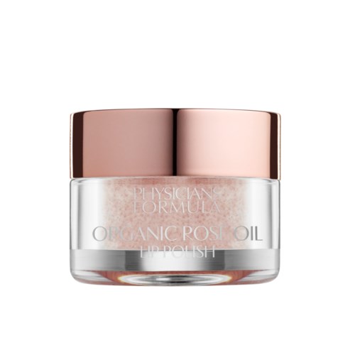 En liten burk med ett rosa-lackat lock innehåller läppglans som heter 'Organic Rose Oil Lip Polish'.