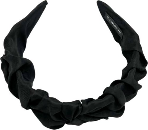 En svart tygband med rundad design och en etikett som säger 'ANNMODULY'.