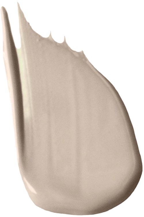 Ett beige, glänsande, tårformigt föremål med spetsig kant och slät yta.