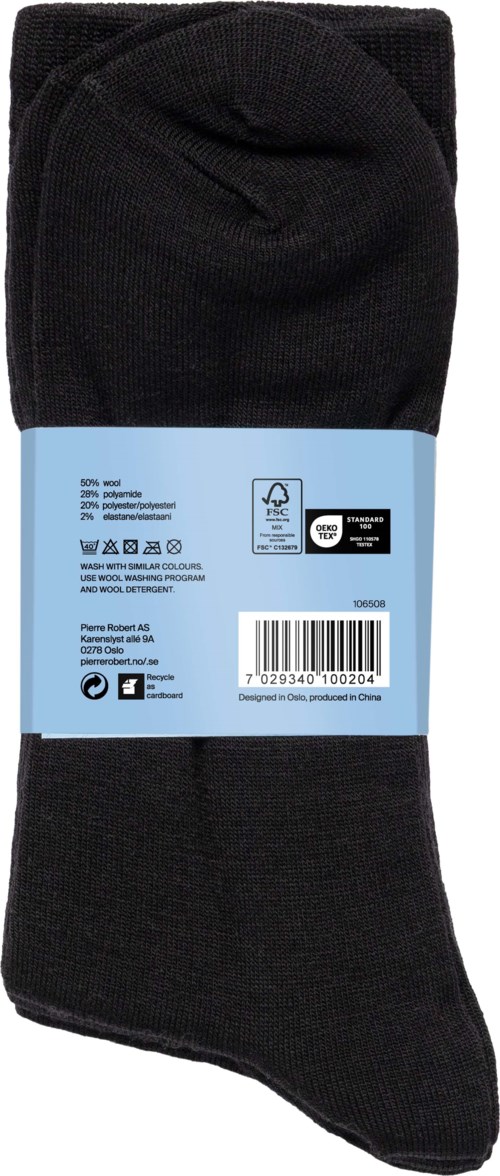 A pair of black socks with a blue label wrapping around the middle, displaying washing instructions and barcode.