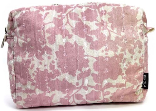 A pink and cream patterned fabric bag with a label on the bottom right corner.