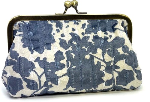 A small clutch purse with a blue and white floral pattern and a metal frame clasp.