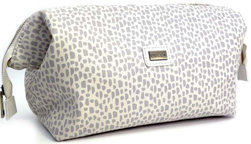 A beige bag with a dotted pattern, metal logo on front, and side zipper details.