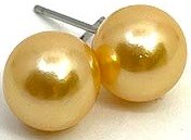 Two shiny gold balls with a small stick, possibly earrings or decorations.