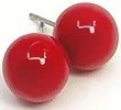 Two red lawn bowl balls with white handles, smooth and shiny.