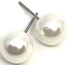 Two large white pearl earrings with silver hooks shown against a plain background.