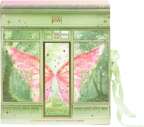 Grüne Verpackung mit rosa Feenflügeln und goldenen Akzenten, Bänder an den Seiten, Text 12 days of glow discovery.