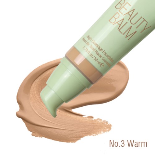 Eine Tube mit 'Beauty Balm' drückt creme auf eine Oberfläche.