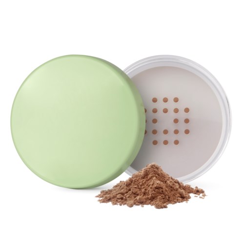 A round green container with a white lid and brown powder inside.