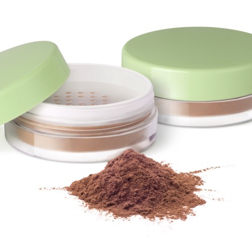 A round container with a green lid and a powder inside, with some powder spilled outside.