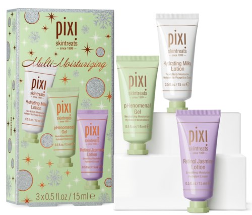 Zestaw małych lotion i żeli do skóry w pastelowych tubkach, razem z ozdobnym pudełkiem z symbolami świątecznymi.
