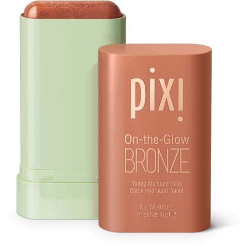 Ett bronzer-stift med ett rosa lock och grön behållare, märkt 'Pixi On-the-Glow Bronze.'