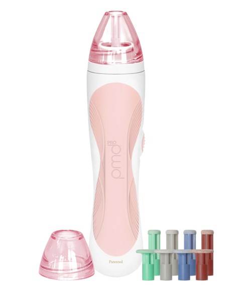 En damp- eller ansigtsspreder med pink og hvid farve, et låg og flere reservedele i forskellige farver.