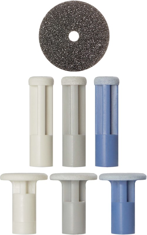 Six cylindrical objects with caps in white, gray, and blue, and a round, black abrasive disc.