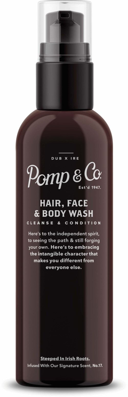 A brown bottle with a black pump, labeled Pomp & Co. Hair, Face & Body Wash, featuring white text and details.
