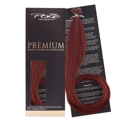 A hair extension package with red extensions and black branding, showing a close-up of the hair strands and packaging.