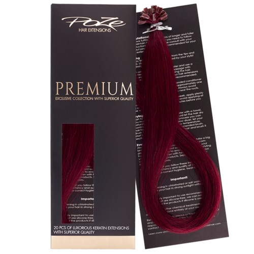A black package says 'Foxy Hair Extensions Premium' with a sample of red hair extension attached.