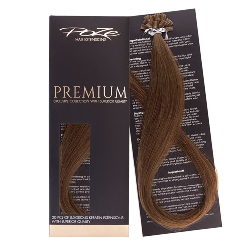 A package of 20 brown hair extensions with a decorative bow. The label says "Premium" and "Exclusive collection".