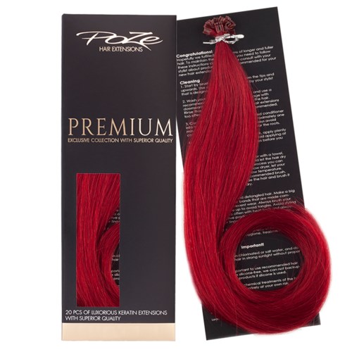 Red hair extensions in a curved style are shown with packaging and instructions. They are long, shiny, and vibrant.