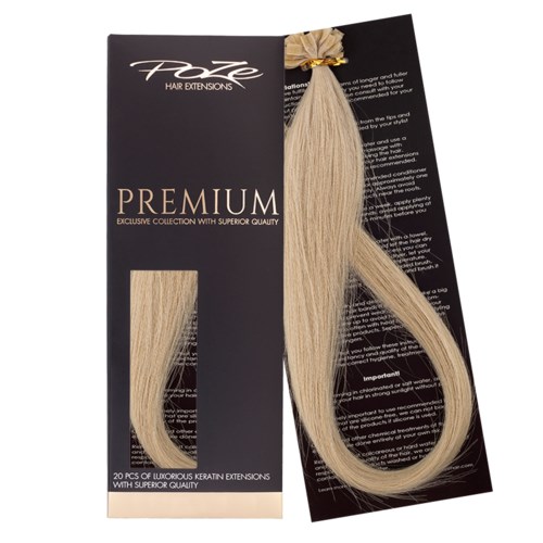 A hair extension set with blonde strands, packaged on a black backing card, labeled 'PREMIUM'.