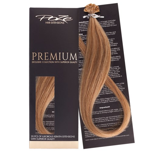A hair extension on black and gold packaging with text, including "PREMIUM" and "20 pcs".