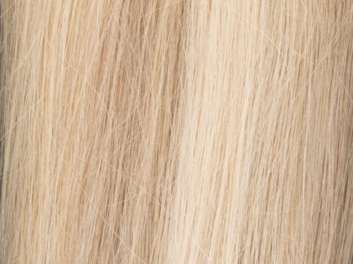 Blont hår med rak textur, nära bild av hårstrån.