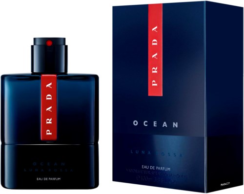 A dark blue perfume bottle with a red label and matching box, labeled 'Prada Ocean Luna Rossa'.