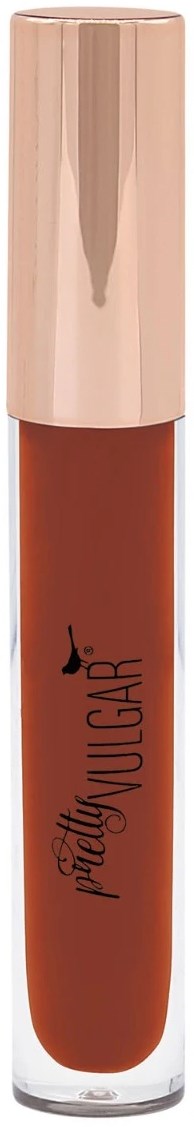 A lipstick tube with a rose gold cap and a clear bottom showing the reddish-brown lipstick inside.