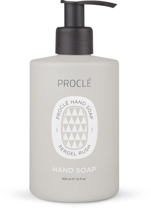 En vit flaska med svart pump märkt 'Proclè Hand Soap' och 'Hand Soap' på framsidan.