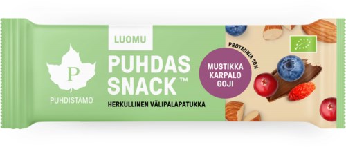 En grön snackbarsförpackning med bär, nötter och text på finska, inklusive en logotyp av ett blad och ett berg.