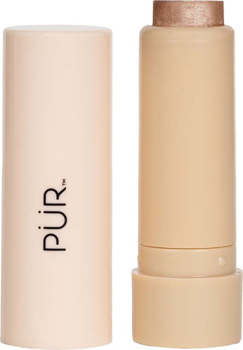 En lys farvet makeup- eller hudplejeprodukt med rund hætte, ved siden af dens hvide beholder.