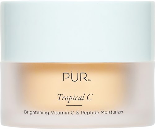 A jar of PÜR Tropical C Brightening Vitamin C & Peptide Moisturizer. It has a white and beige container with a blue lid.
