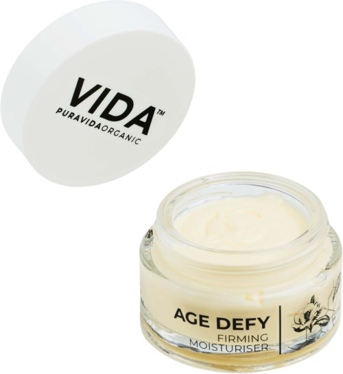 En bøtte mærket 'AGE DEFY' med creme indeni, og et låg med 'VIDA'-logo over.