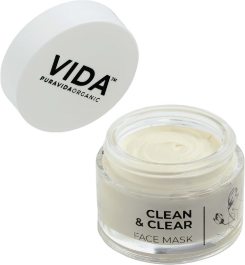 En burk med krämig ansiktsmask med lock som säger 'VIDA PURAVIDA ORGANIC' och en etikett 'CLEAN & CLEAR FACE MASK.'
