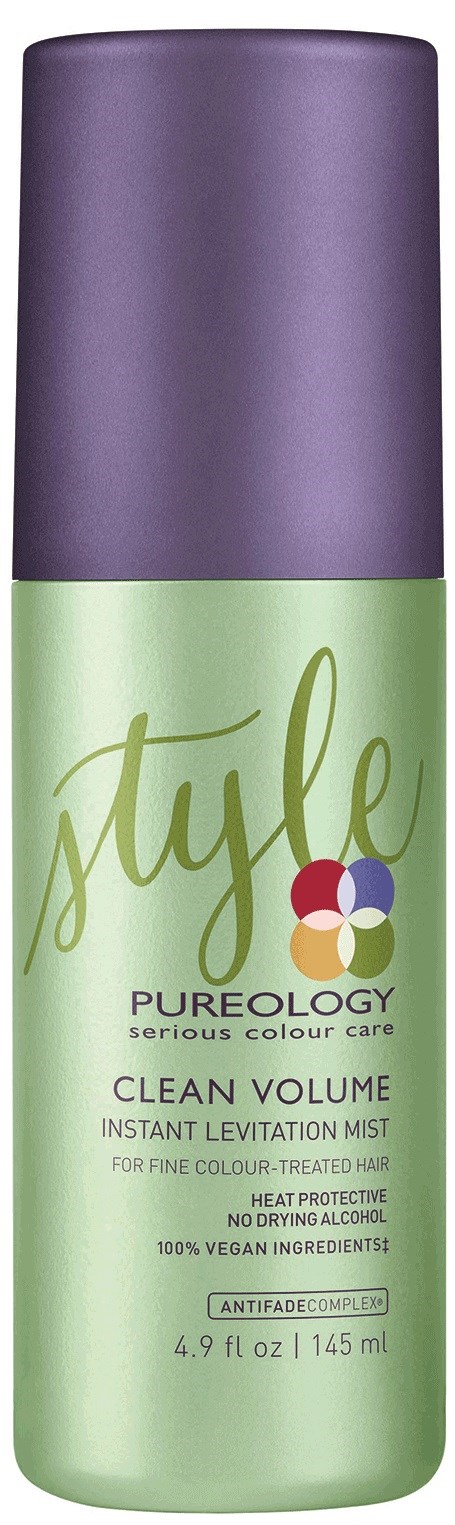 En gröngul och lila flaska med hårspray märkt 'Style & Pureology Cleaning Volume Mist' för färgbehandlat hår.